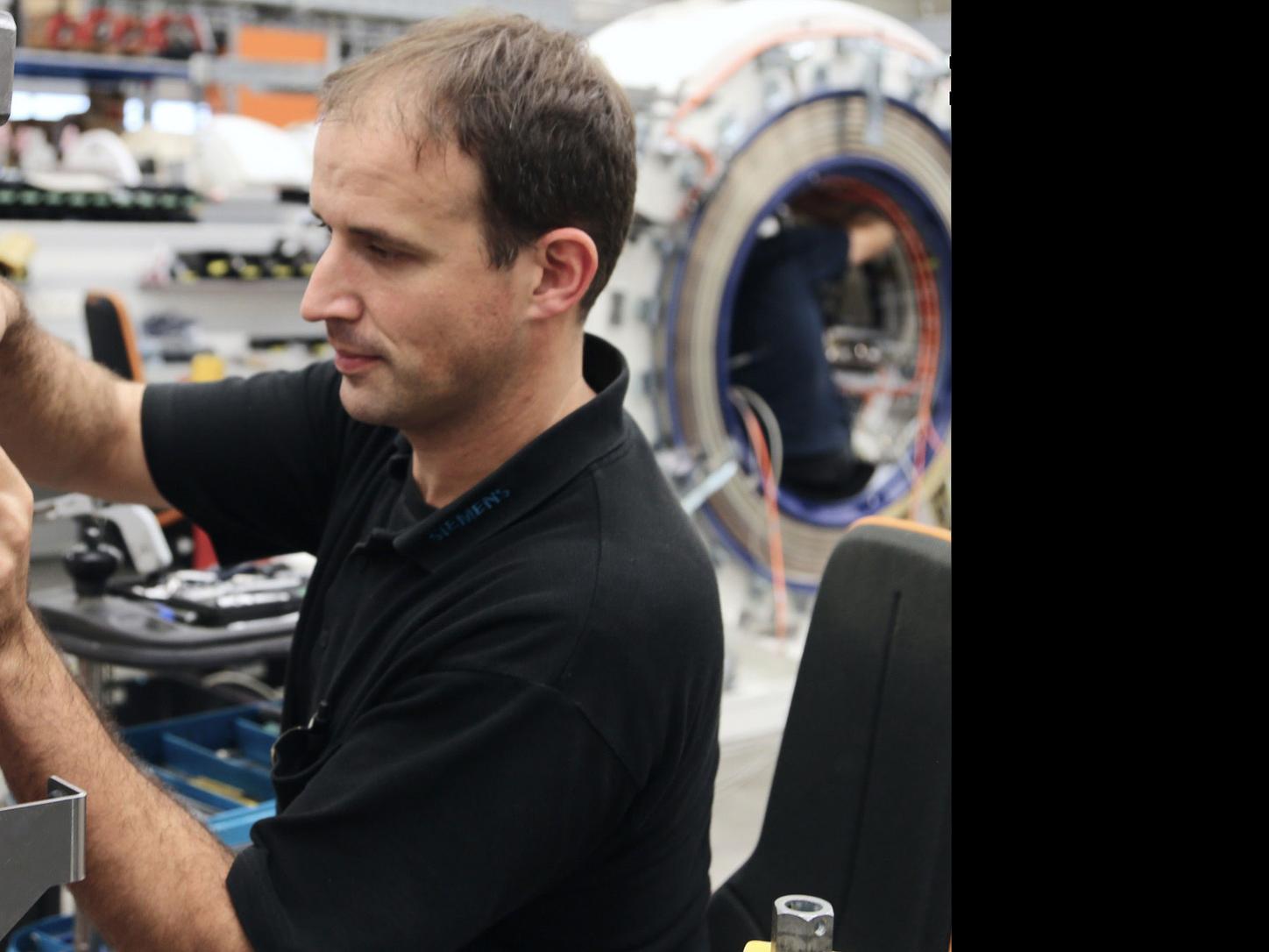 photo of a person building an MRI
