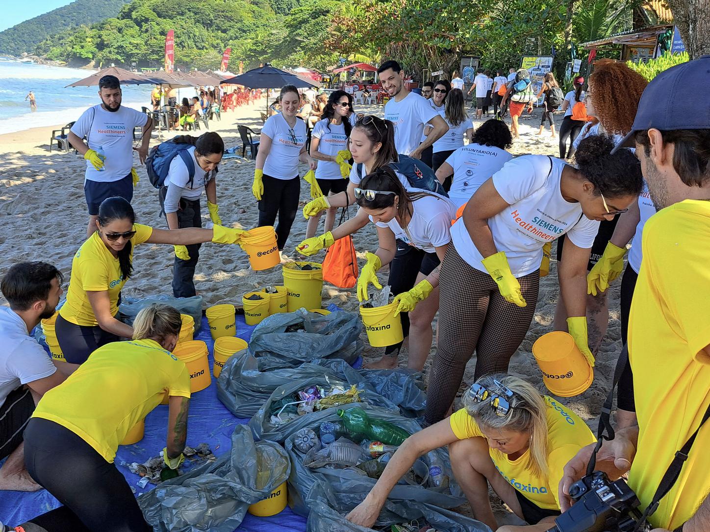 bucket full of trash collected at the beach