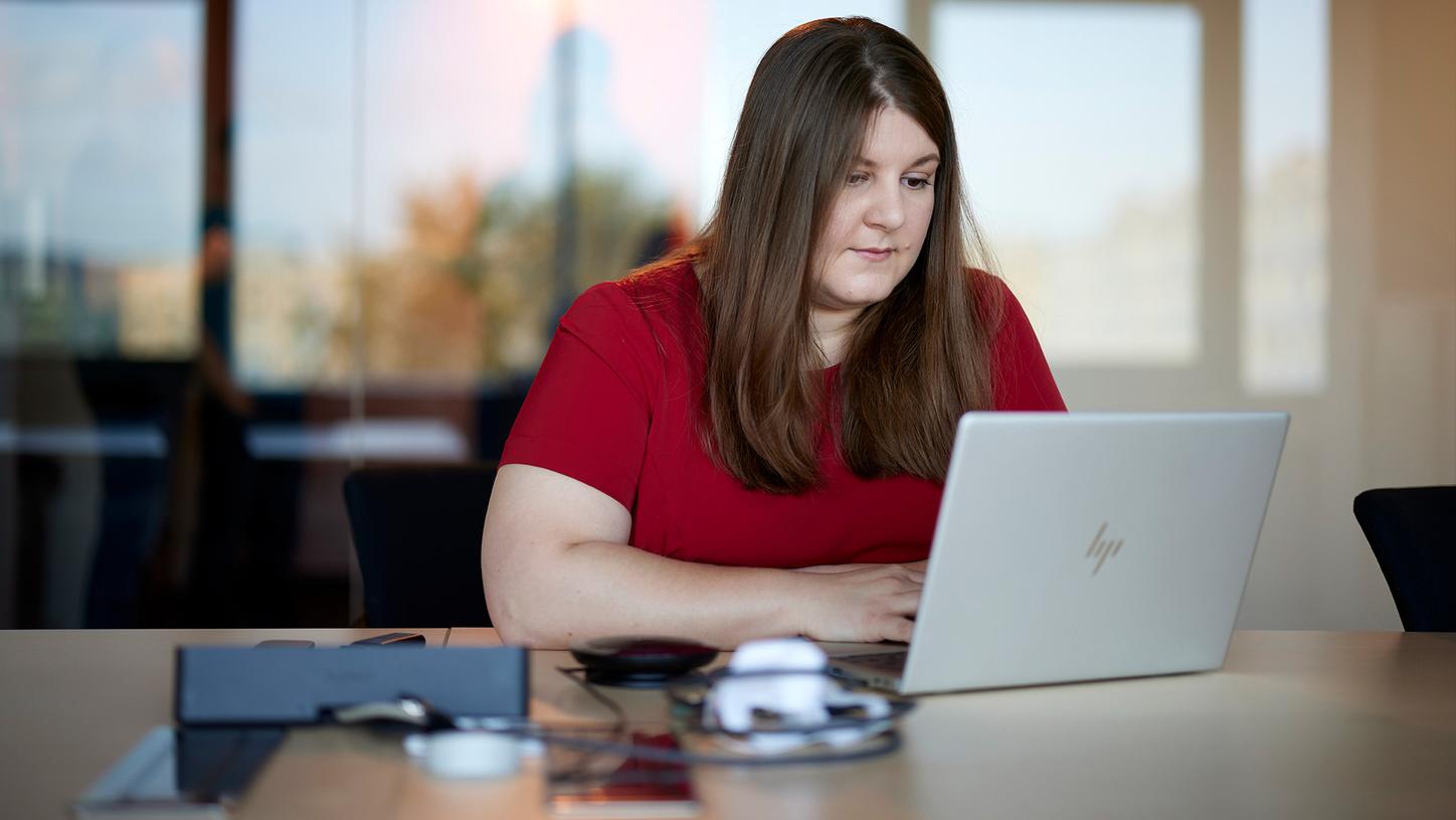 Terezia looking at her laptop typing