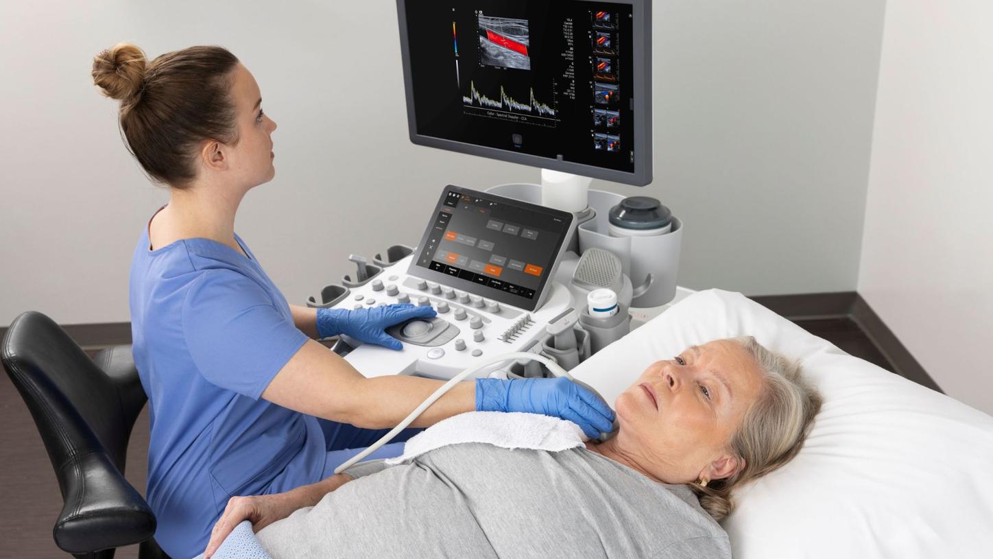 Sonographer examining a patient with the ACUSON Sequoia ultrasound system