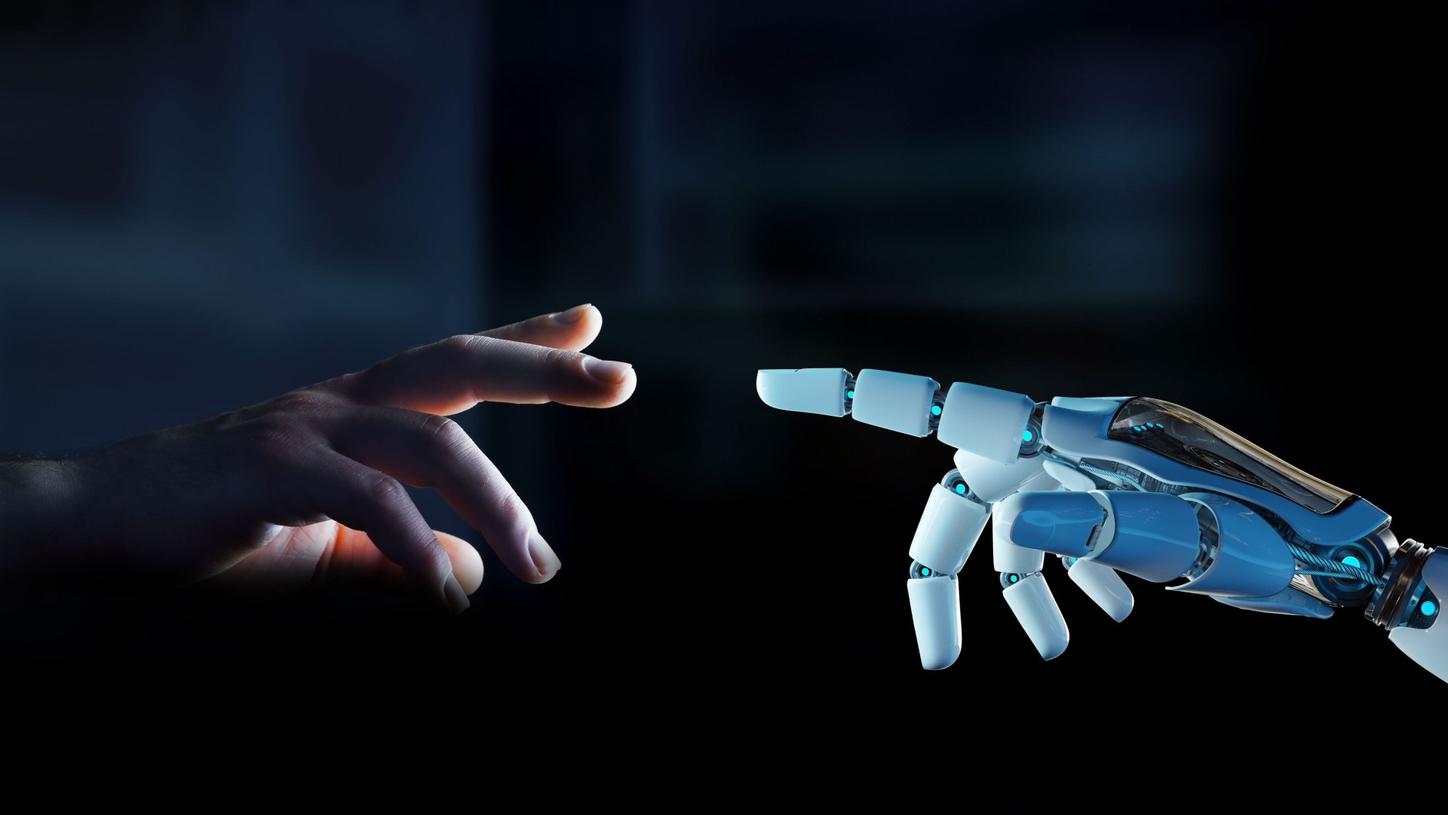 A human hand and a robotic hand reach towards each other, nearly touching, symbolizing the connection between humanity and technology.