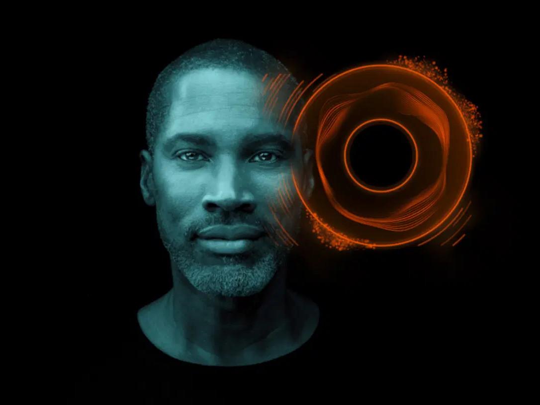 portrait of a man with a futuristic orange circular graphic overlaying the side of his face, symbolizing advanced technology and innovation.