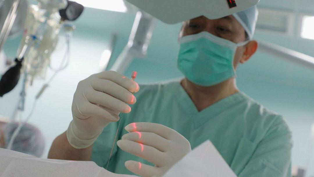 A surgeon is preparing for needle resection of a liver tumor